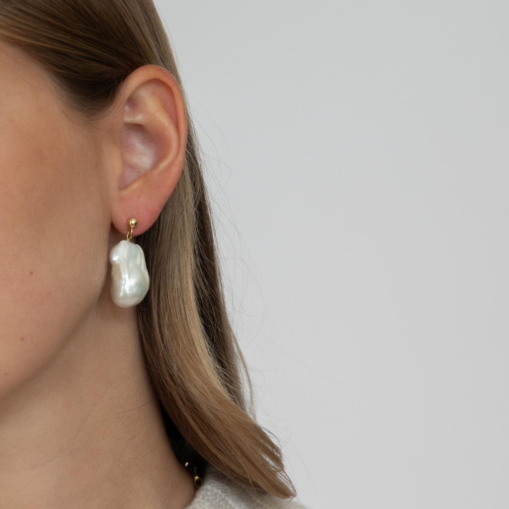 Classic Big Baroque Study, timeless statement earrings. made of responsibly sourced freshwater pearls and recycled 14k gold by the sustainable jewelry brand LLR Studios.
