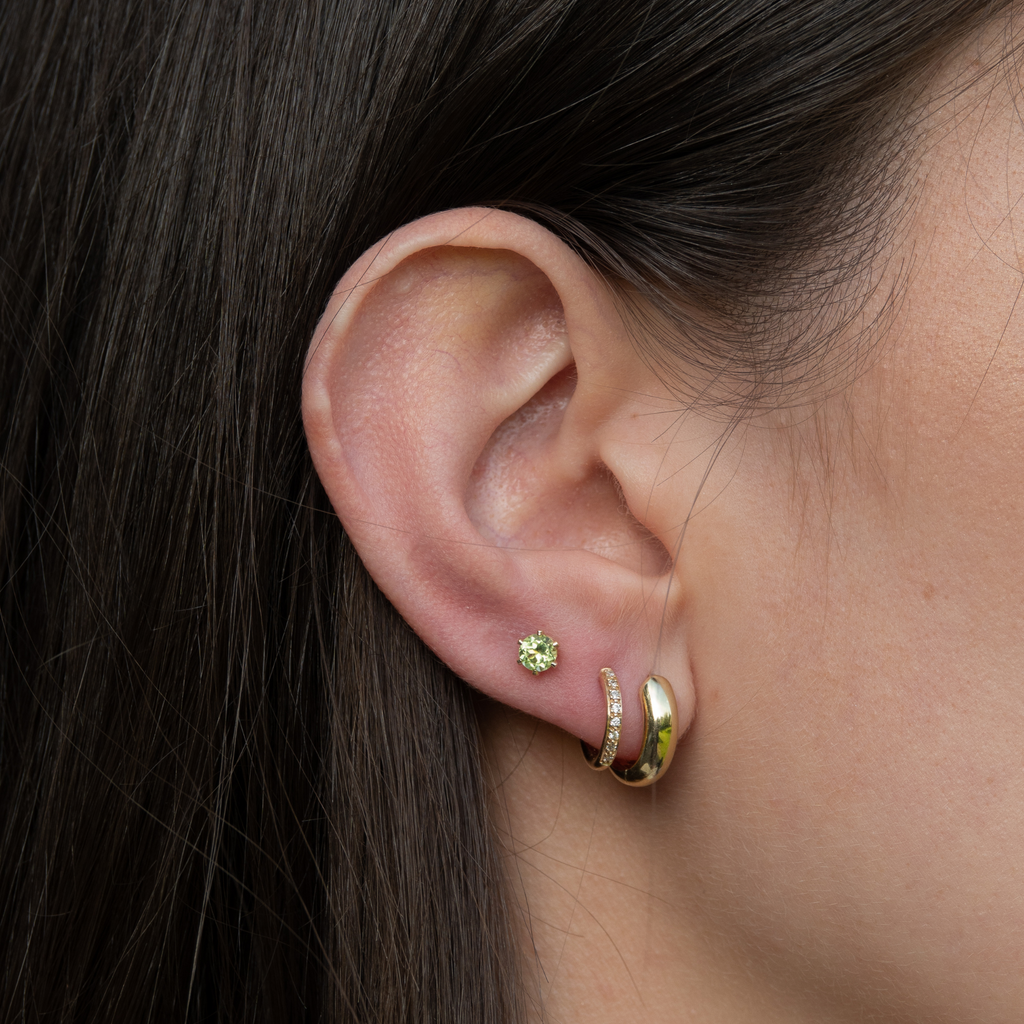 green peridot stud earrings 14k gold made in Germany from sustainable jewelry brand | styled with our 14k gold diamond hoops and Big Big Creoles LLR Studios