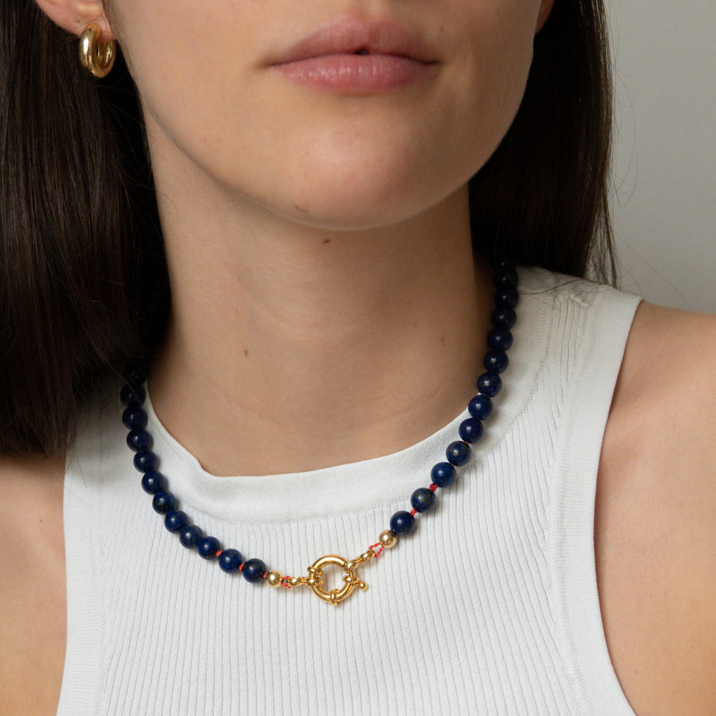 blue lapis gemstone necklace with gold accents and orange silk band from sustainable jewelry company LLR Studios